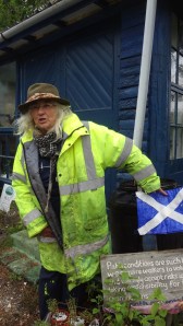 This is Sandy Masson. She is pointing to a flag of Scotland. Fair to say she is pro - independence. Something they will be voting on September 2014.