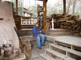 Me wadding my pieses. Wadding is like a mixture like home made play dough that you stick on the bottom of your pieces so that they don't become permanently attached to the shelves. Not a fun part to do. 