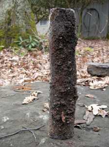 What happens when a piece falls off of the bag wall into the fire.