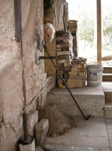Marlene peeks out over the large pile of ash we did not remove before all of this - Let that be a lesson to all wood fire folk. 